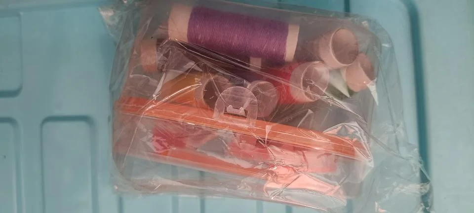 Top view of a simple sewing kit in the clear box Stock Photos