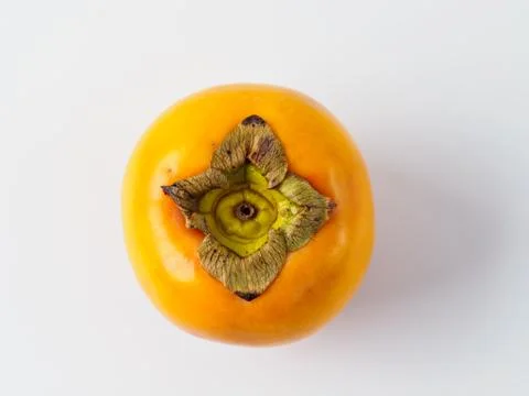 Top view of single persimmon isolated on white background. Stock Photos