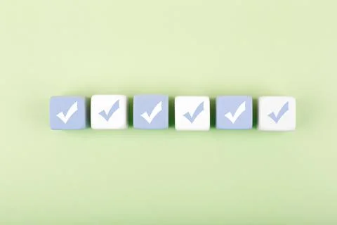Top view of six blocks with check marks on light background Stock Photos