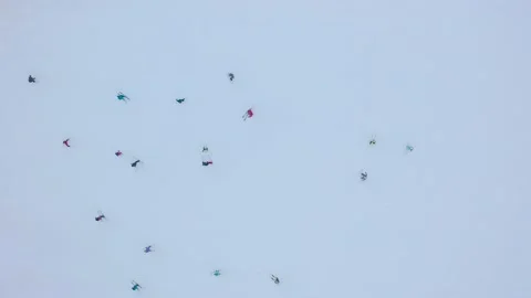 Top view of the ski slope - a lot of people pass it on skis and snowboards. Stock Footage 143701302