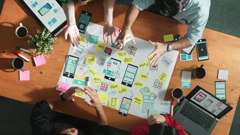 Top view of skilled business team discuss idea about Ux Ui design. Convocation. Stock Footage 266453327