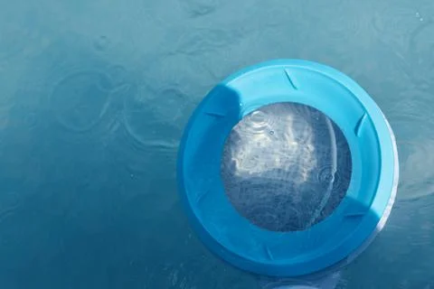 Top view of the skimmer for cleaning the pool in clear water. Close-up of the Stock Photos