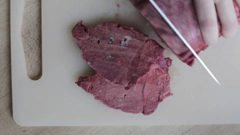 Top view of sliced beef lung. Raw beef lung is cut on a plastic board Stock-Footage 240082020
