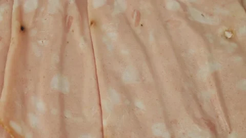 Top view of sliced boiled ham sausage. Fresh Italian mortadella, boiled Bologna Stock Footage 216007970