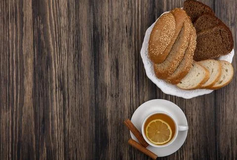 Top view of sliced breads as seeded brown cob rye and white ones in plate a.. Stock Photos