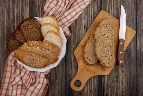 Top view of sliced breads as seeded brown cob rye and white ones in plate o.. Stock Photos