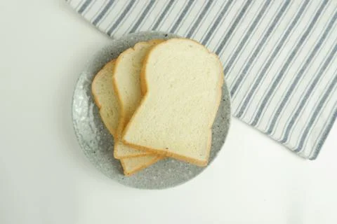 Top view slices of bread top view on white background Stock Photos