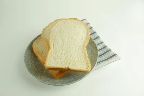 Top view slices of bread on white background Stock Photos