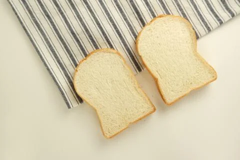 Top view slices of bread on white background Foto stock