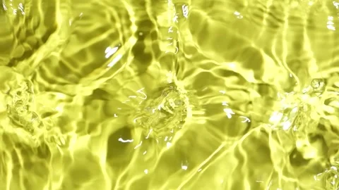 Top view slow motion of abstract golden yellow water ripples with light caustics Stock Footage 344953734