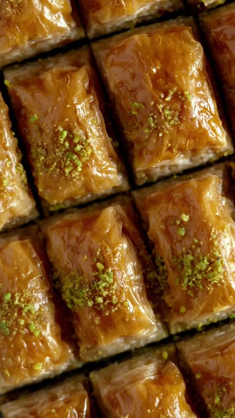 Top view slow motion of baklava dessert pieces rotating Stock Footage 332084608