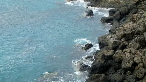 Top view slow motion of calm ocean waves on rocky shore Stock Footage 319845348