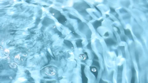 Top view slow motion diverging circles of water Stock Footage 250738960
