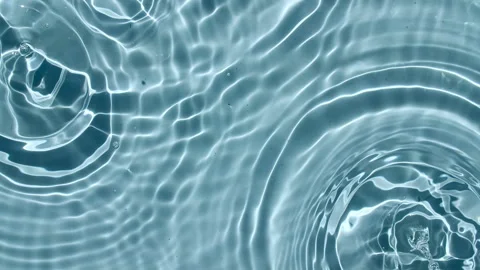 Top view slow motion of drop falls into water and diverging circles of water on Stock Footage 162949954