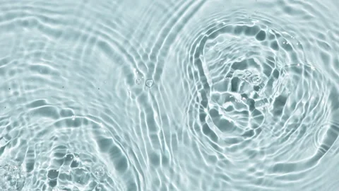 Top view slow motion of drop falls into water and diverging circles of water on Stock Footage 248134527
