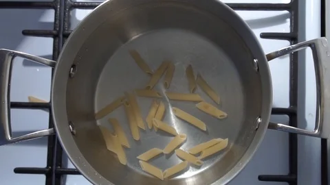 TOP VIEW slow motion: Falling pile of pasta cuts, slow motion. Pasta penne in Stock Footage 101739214