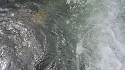 Top view slow motion ripples of clear mountain river surface Stock Footage 320921551
