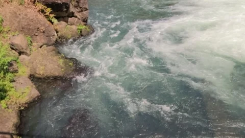 Top view slow motion of water waves flowing on the river bank Stock Footage 320056379