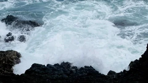 Top view slow motion of waves rolling on the shore Stock Footage 319872875