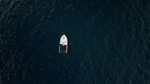 Top View Small Atlantic lobster boat checks lobster traps in Peggy's Cove Stock Footage 274917147