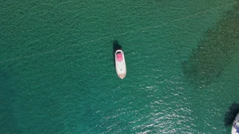 Top view of a small boat in the mediterranean sea with crystal clear water Stock Footage 168306257