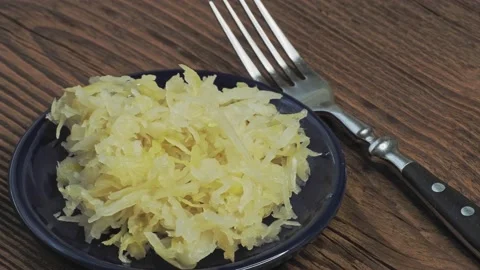 Top view of a small bowl filled with canned sauerkraut Stock Footage 170996993