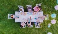 Top View Of Small Children Sitting At The Table Outdoors On Garden Party. Stock Photos
