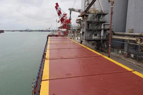 Top view of small general cargo ship berthed at sea port Stock-Fotos