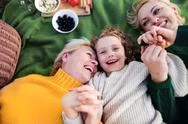 Top View Of Small Girl With Mother And Grandmother Having Picnic In Nature. Stock Photos