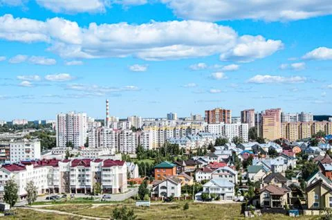 Top view of a small provincial town against the blue sky on a sunny summer da Stock Photos