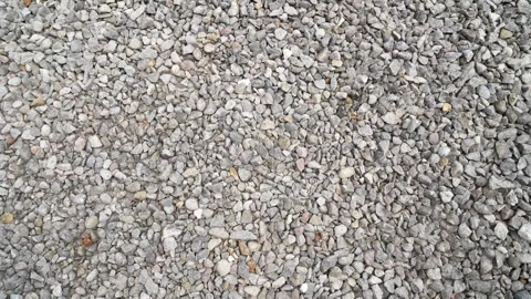 Top view of small, varied grey crushed gravel stones. Vidéo 340418659