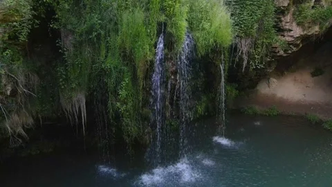 Top view of small waterfall with blue lake Stock Footage 156329507