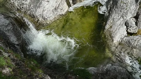 Top view of a small waterfall running into a pool (slow motion) Stock-Footage 260845152