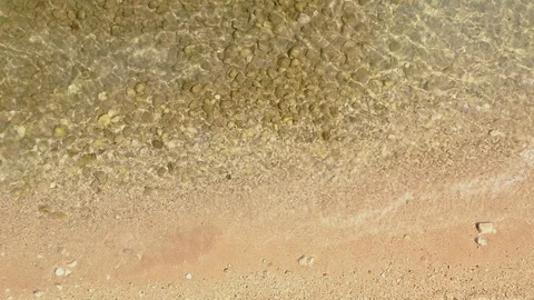 Top View Of Small Waves Break On Beach Video stock 115248064