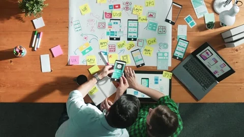 Top view of smart manager working together to develop Ux Ui design. Convocation. Stock Footage 266754570