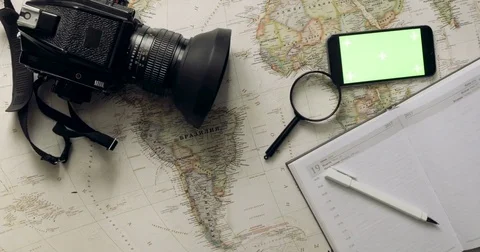 Top view. smart phone with green screen lies on the diary. Planning holidays Stock Footage 84166007