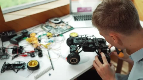 Top view of smart student study car model construction at table. Edification Stock Footage 283048113