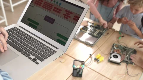 Top view of smart teacher coding prompt while children learning board. Pedagogy. Video stock 277246163