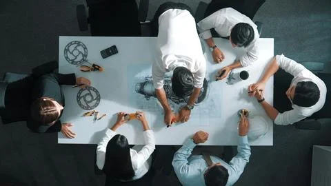 Top view of smart team working together to design turbine engine. Alimentation. Stock Photos