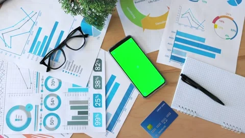 Top view of smartphone with green screen on the office desk. Application for Stock Footage 164531866
