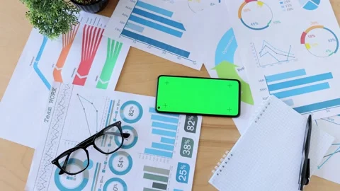 Top view of smartphone with green screen on the office desk. Application for Stock Footage 164532225