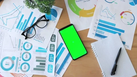 Top view of smartphone with green screen on the office desk. Application for Stock Footage 194381622