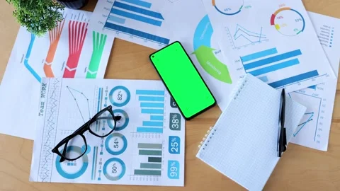 Top view of smartphone with green screen on the office desk. Application for Stock-Footage 203797026