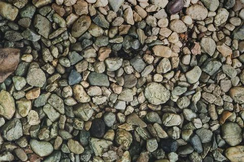 Top view smooth round pebble stones abstract texture background. Vacation hol Stock Photos
