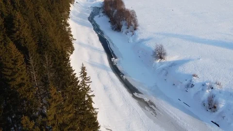Top view of the snowy fields and forest. Quadrocopter shooting at sunset Stock-Footage 125317044