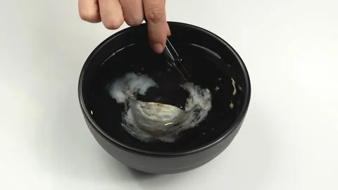 Top View Soaking Raw Bird Nest In Black Bowl Of Water Stock Footage 339370263