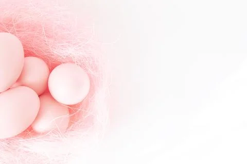Top view of soft pink Easter eggs lying in a pink nest. Horizontal layout. Happy Stock Photos