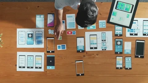 Top view of software developer holding tablet while choosing icon. Convocation. Stock Footage 268486551