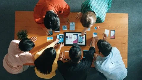 Top view of software developer team looking Ux design from tablet. Convocation. Stock Photos