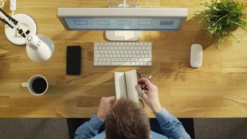 Top View of Software Engineer Writing Down Work Related List in His Notebook  스톡 동영상 71454371